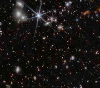 Supermassive-black-holes-are-merging-in-the-galaxy-system-ZS7