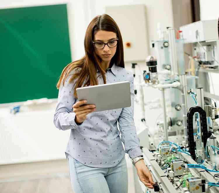 Woman Using IoT Sensors In Lab