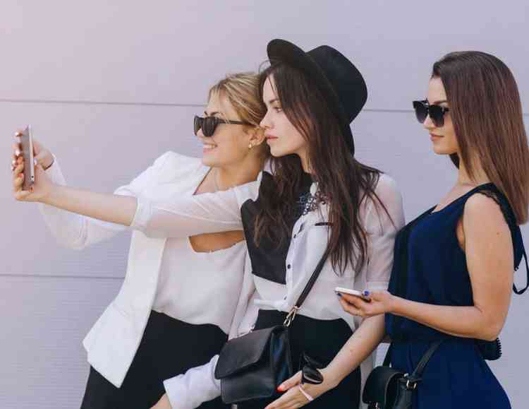 a group of firends posting on social media