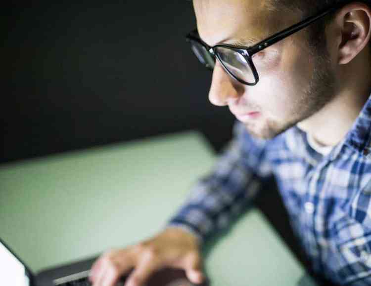 developer using computer to develop code