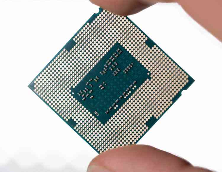 person holding a modern computer chip